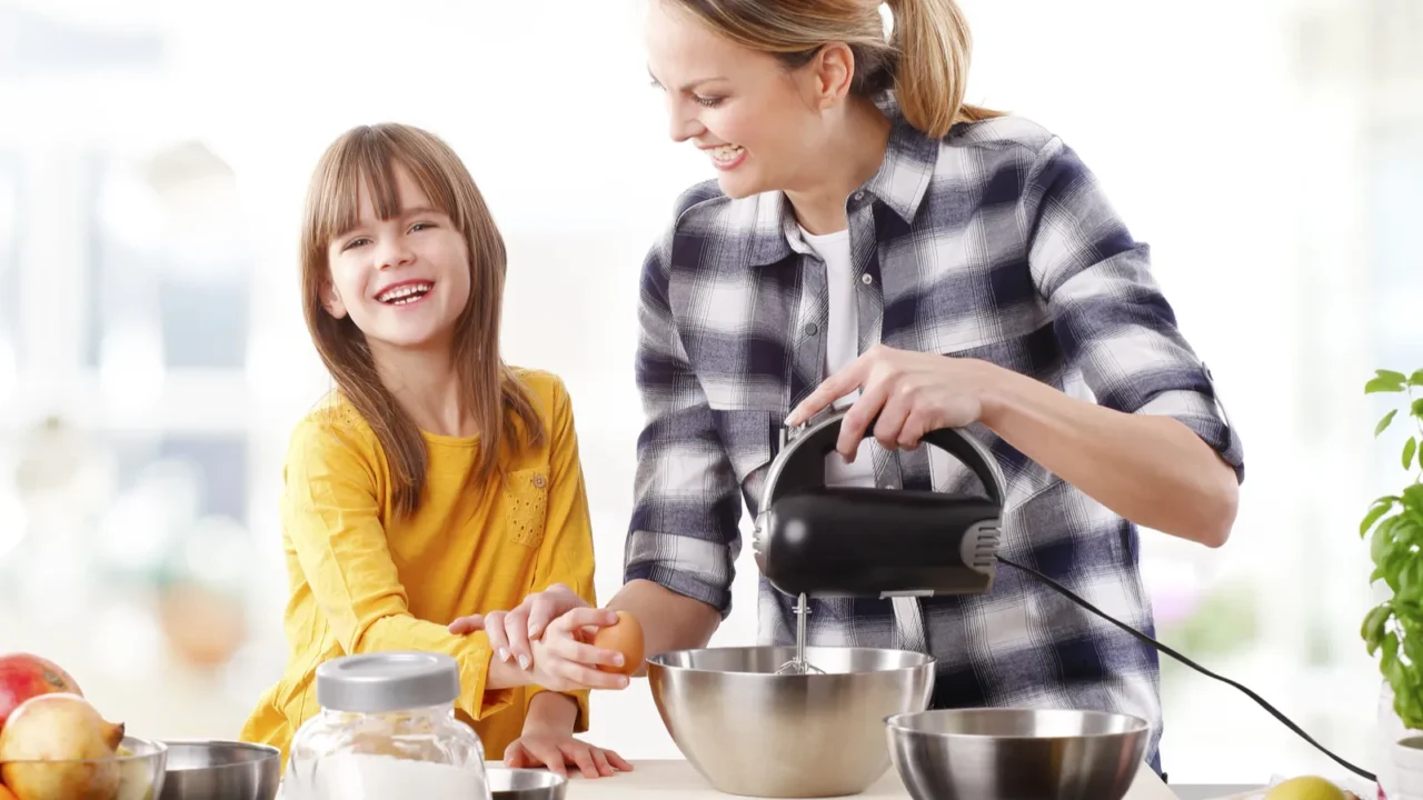 girl and mother mixing the ingredients.