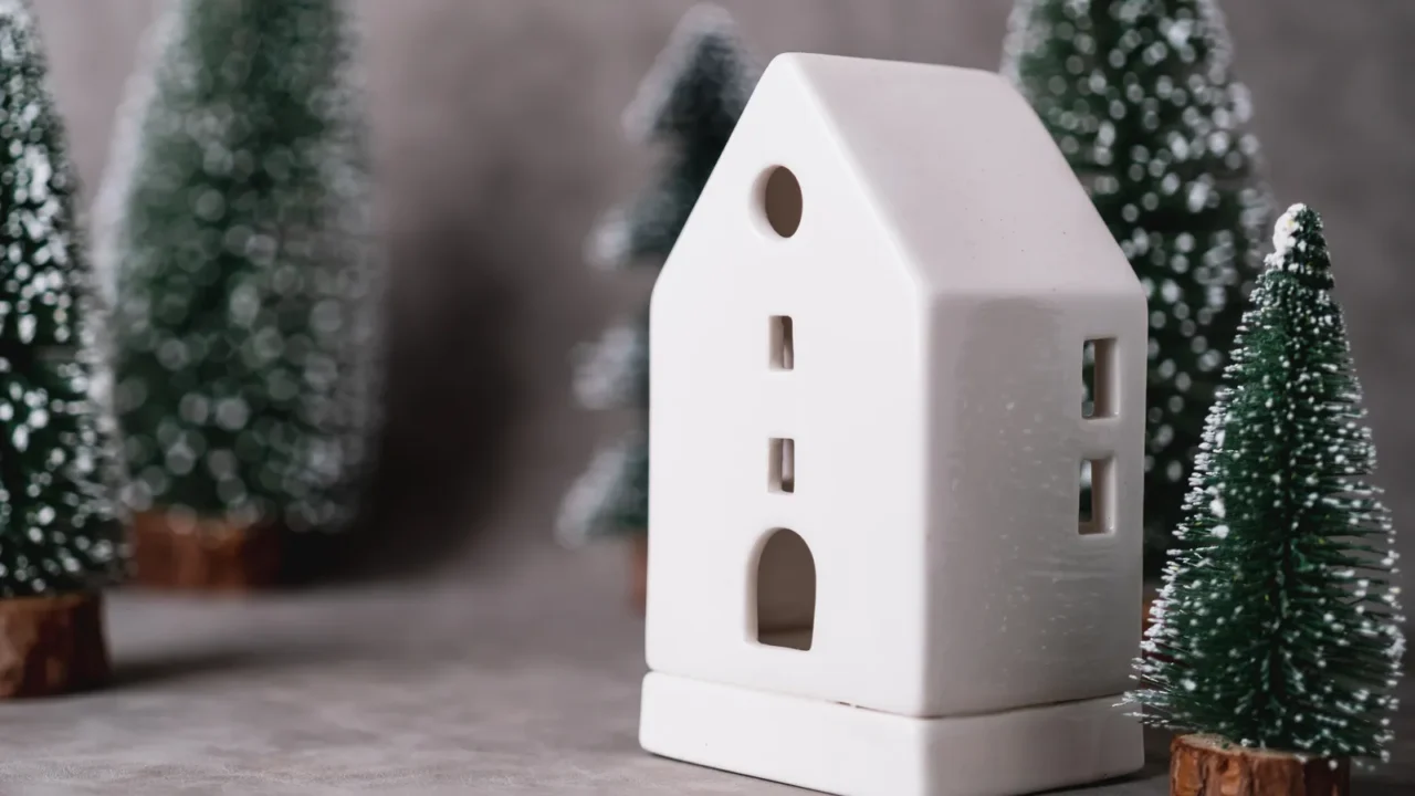 house model with christmas tree and grey leather background