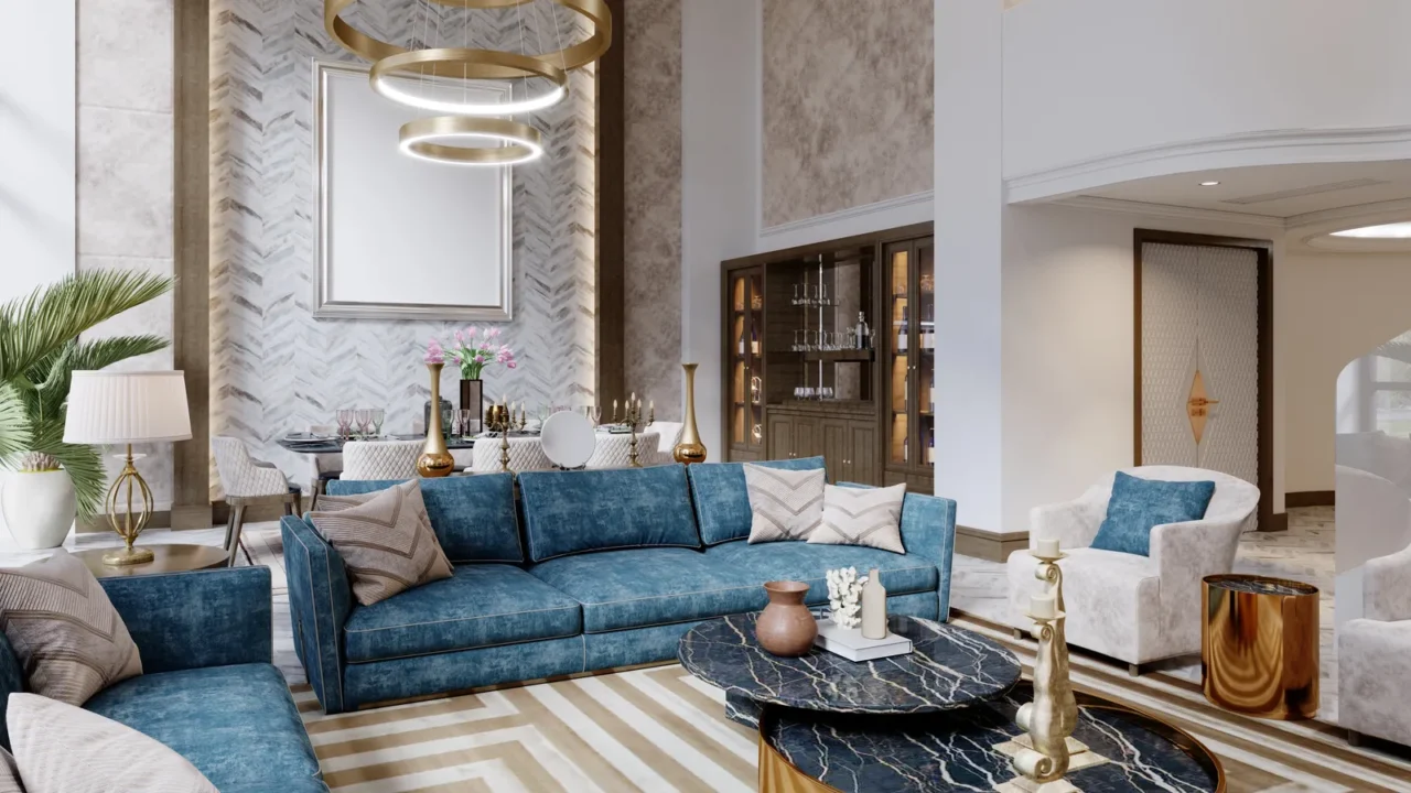 A luxurious living room with a blue velvet sofa, a marble coffee table, and a gold accent wall.