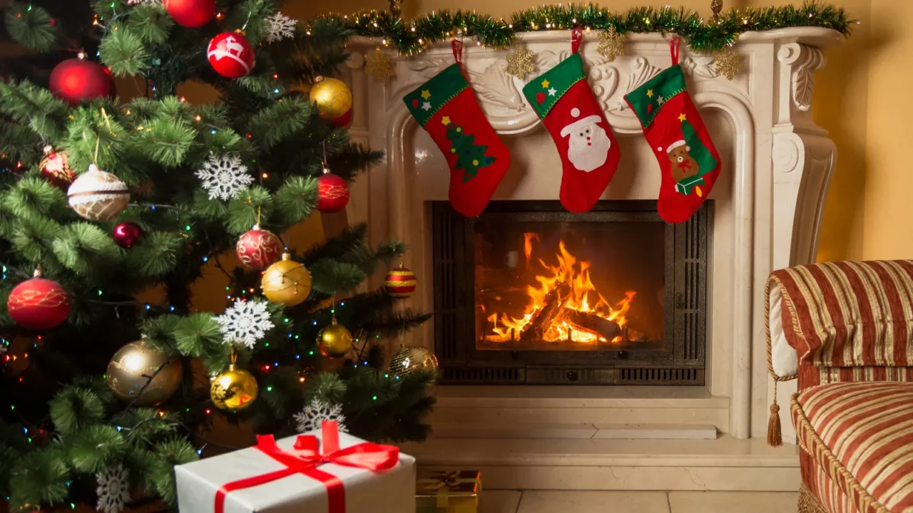 interior image of living room with burning fireplace decorated