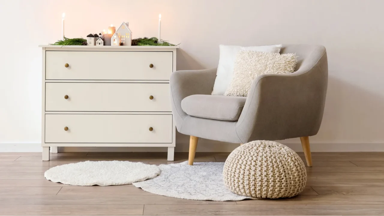 interior of living room decorated for christmas with armchair and