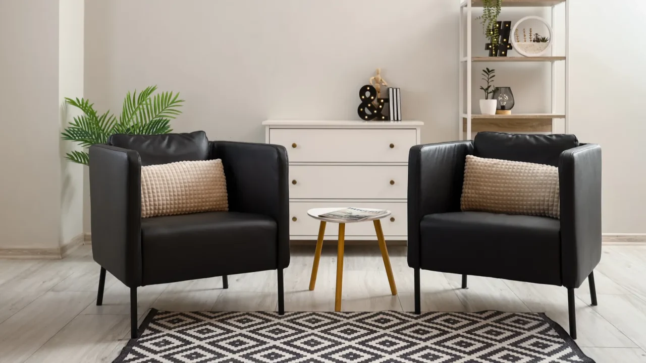 interior of modern living room with black armchairs and table