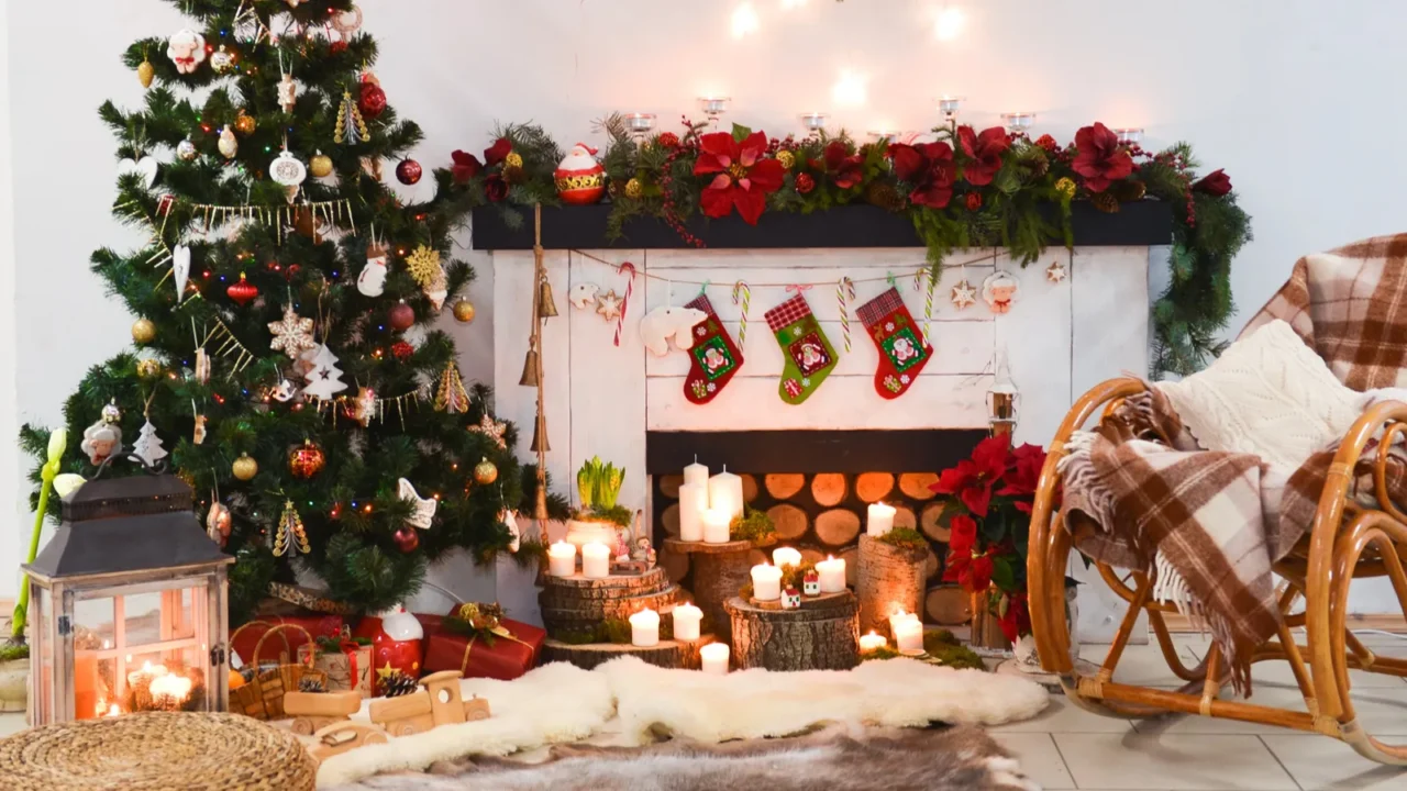 interior photo studio with Christmas decor. Fireplace, Christmas tree, gifts of the New Years scenery