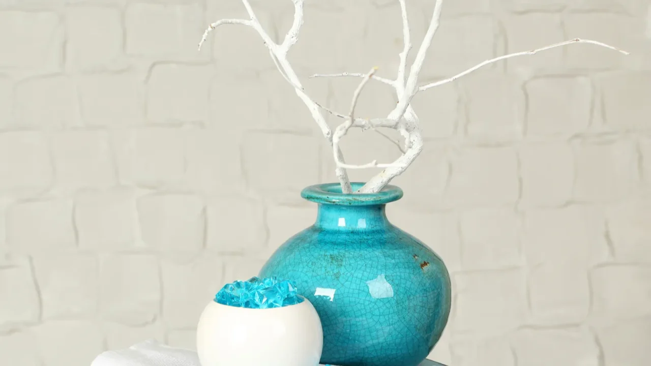 interior with decorative vases on nightstand and white brick wall