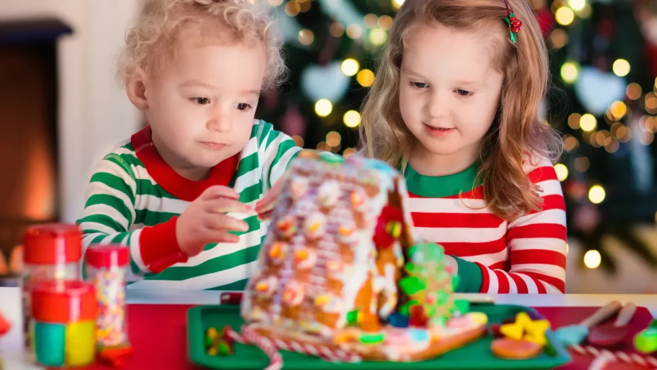 kids making christmas ginger bread house