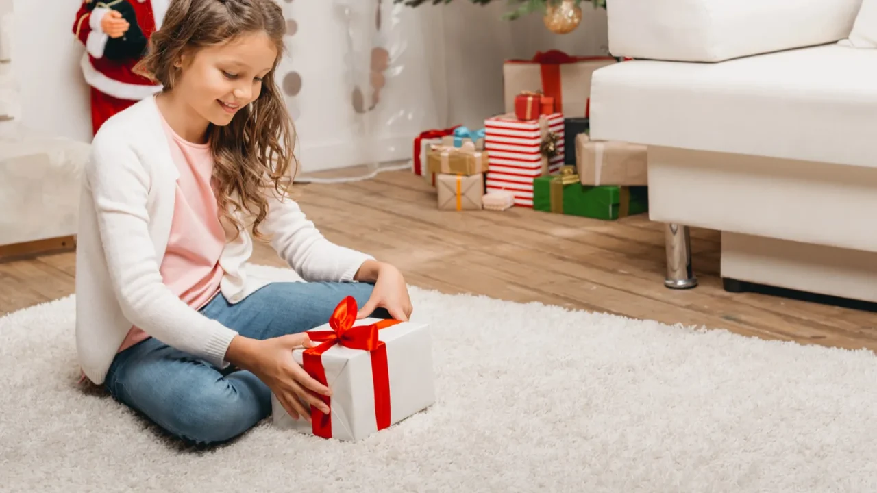 little kid with christmas gift