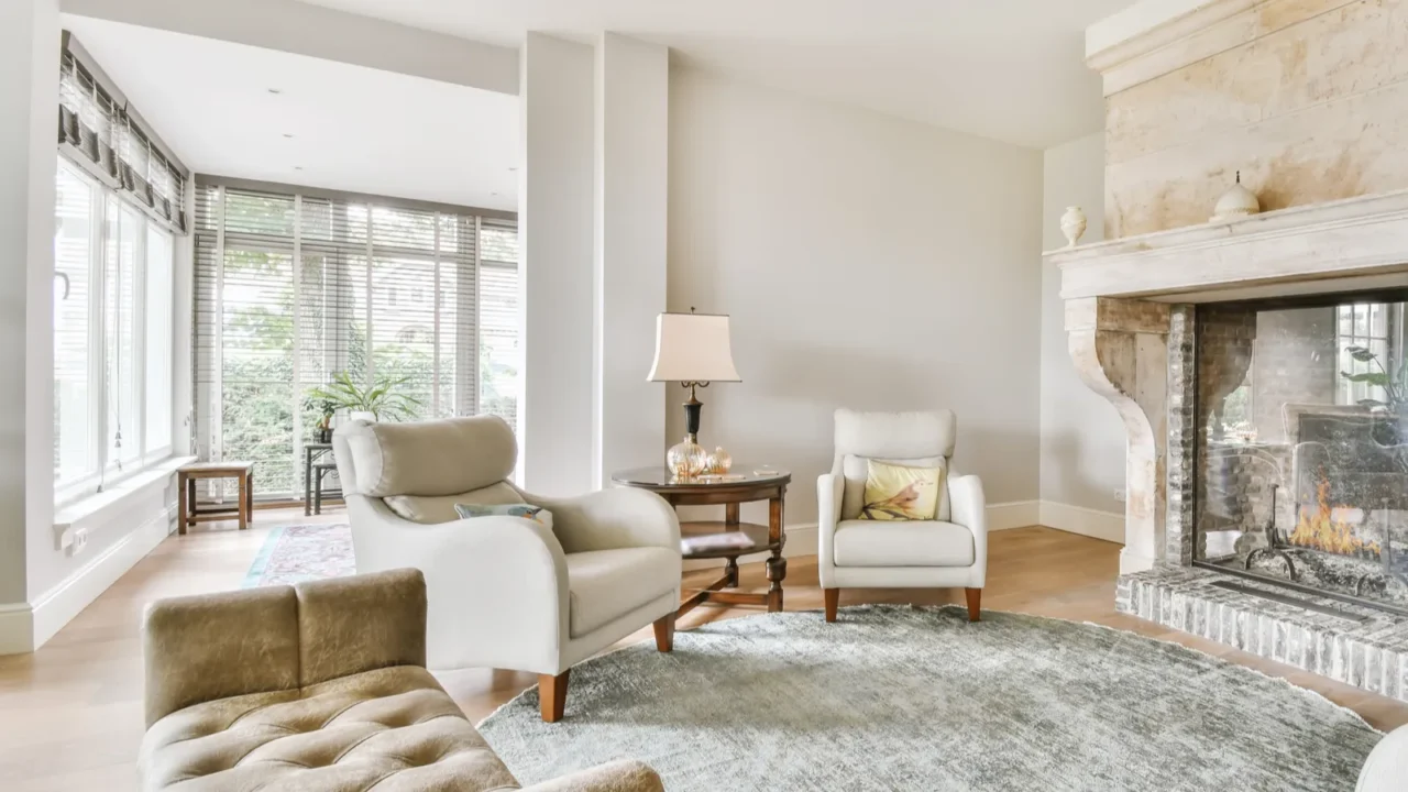 Luxurious living room with white anf neutral color interior - sofa, walls, and curtains, rug.