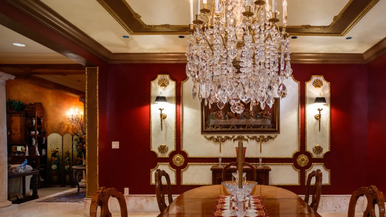 Luxury dining room with a long wooden table, chandeliers, and vintage lighting and setting,