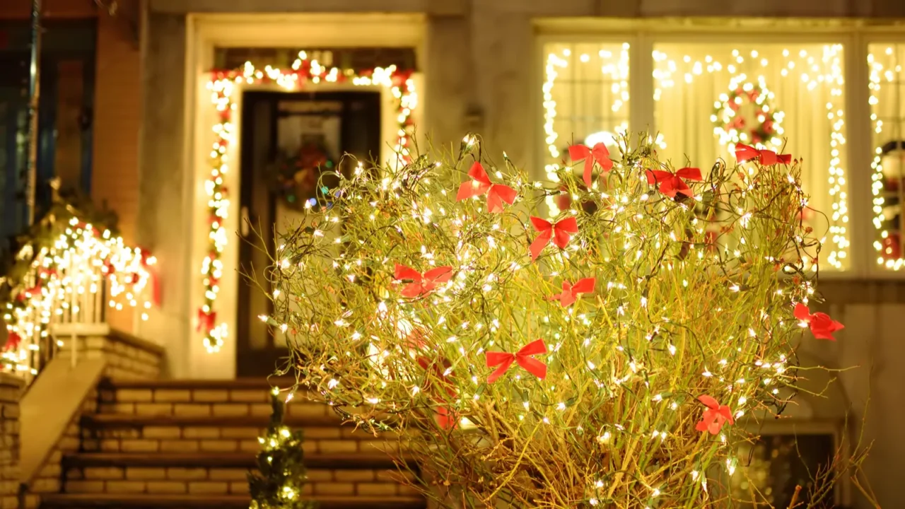 magically decorated courtyard staircase and house for the christmas and