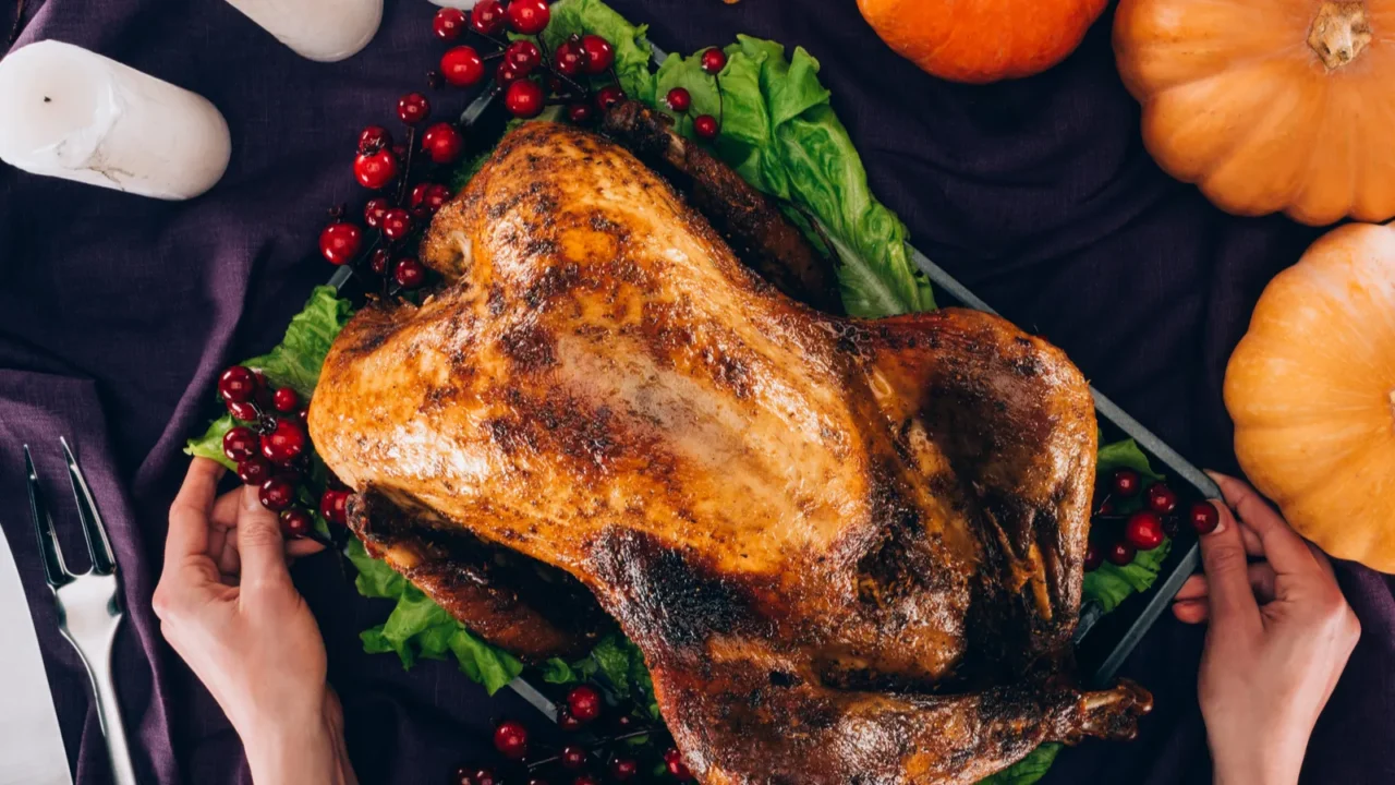 man serving turkey for thanksgiving day