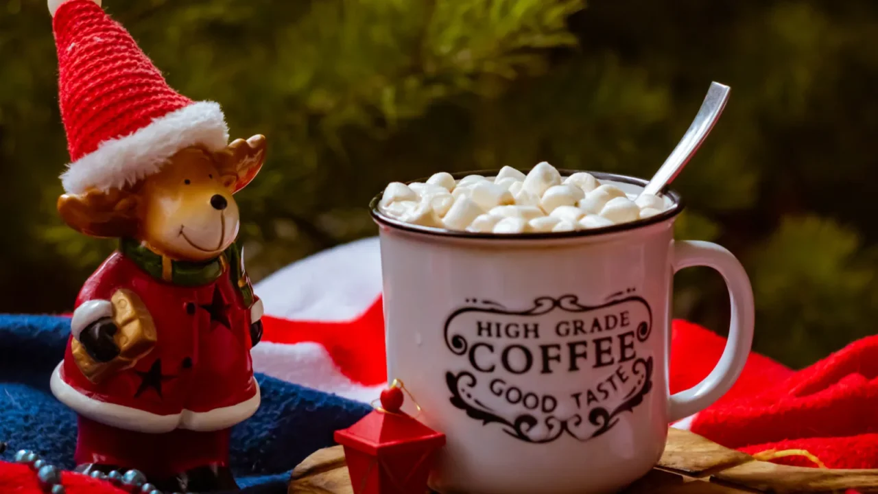 mug of cocoa with marshmallows on a dark background on