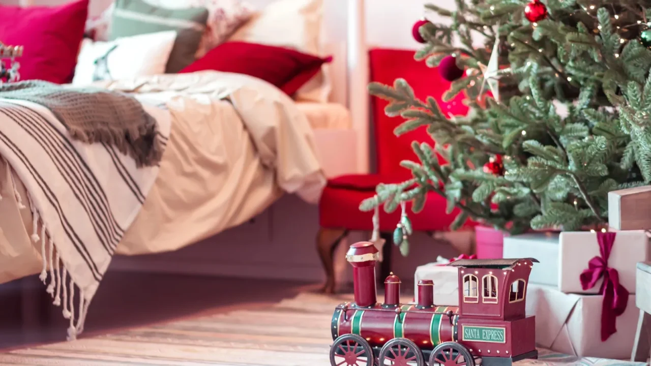 new years toy locomotive under the tree in the bedroom