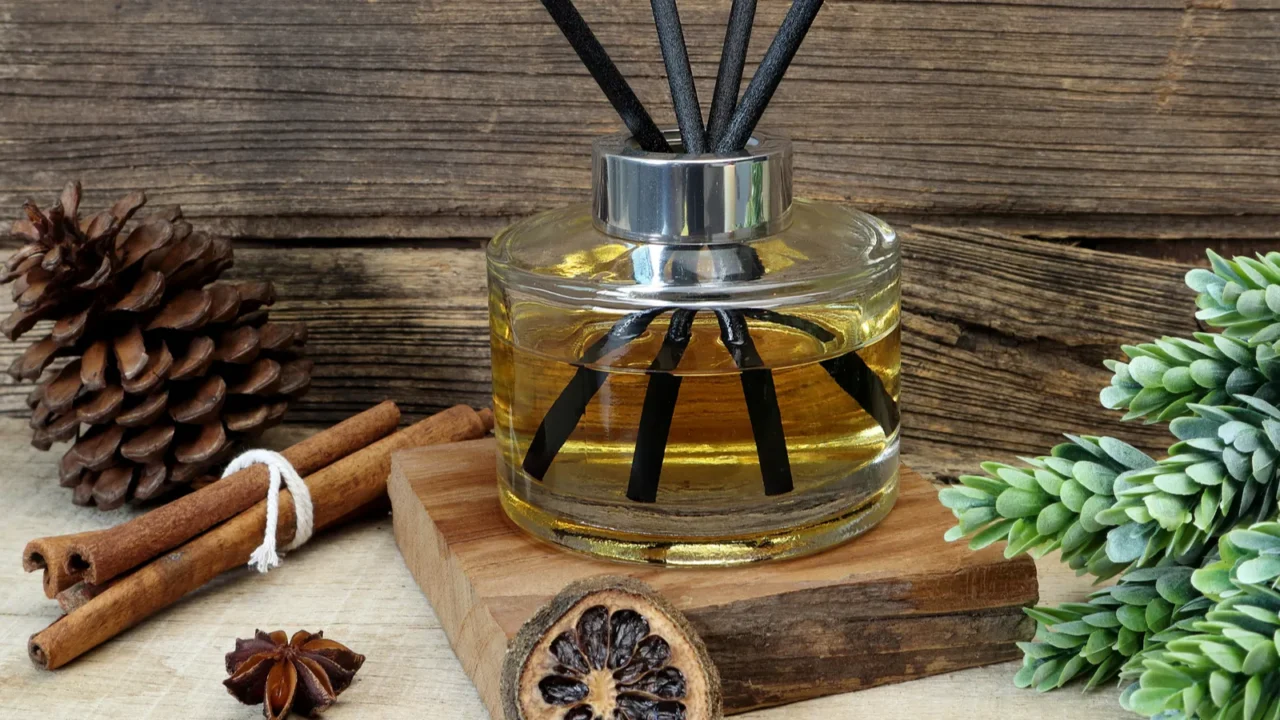 nice aromatic scented reed diffuser air freshener bottle on wooden