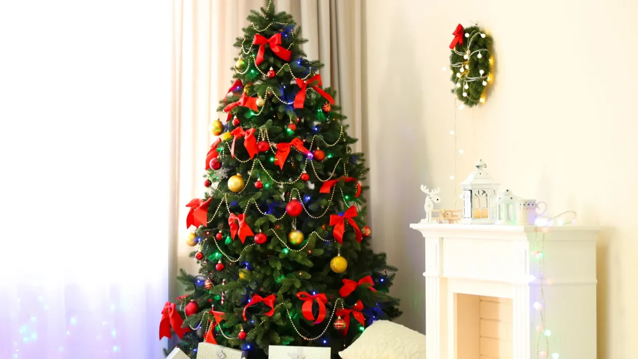 perfect christmas tree with gifts underneath in living room