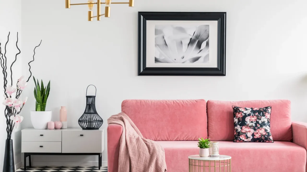 pink blanket on settee in white living room interior with