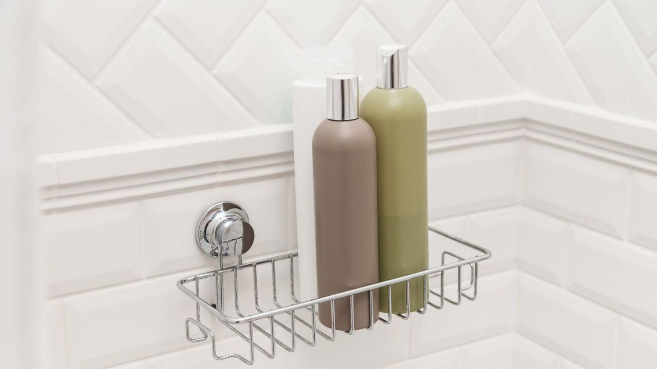 Toiletries bottles on suction cups compact bath shelf, fixing on tiled wall without drilling.