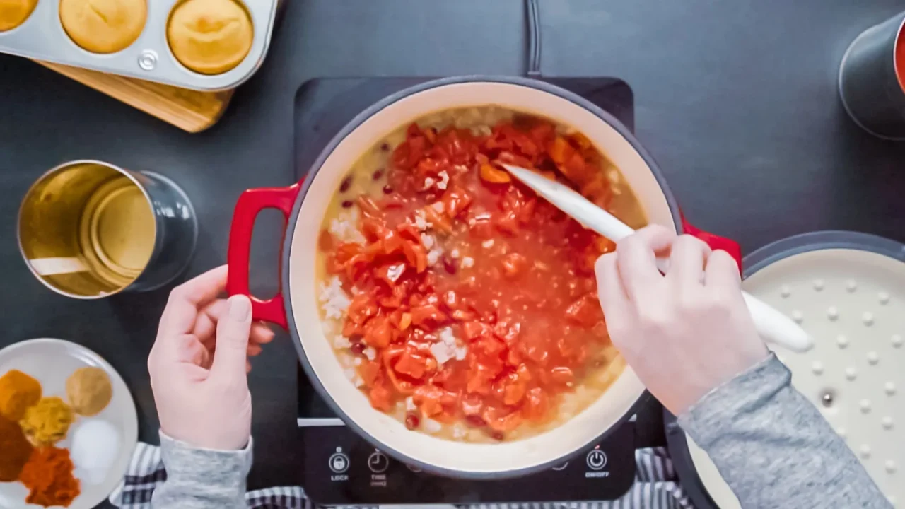 step by step top view cooking turkey chili in enameled