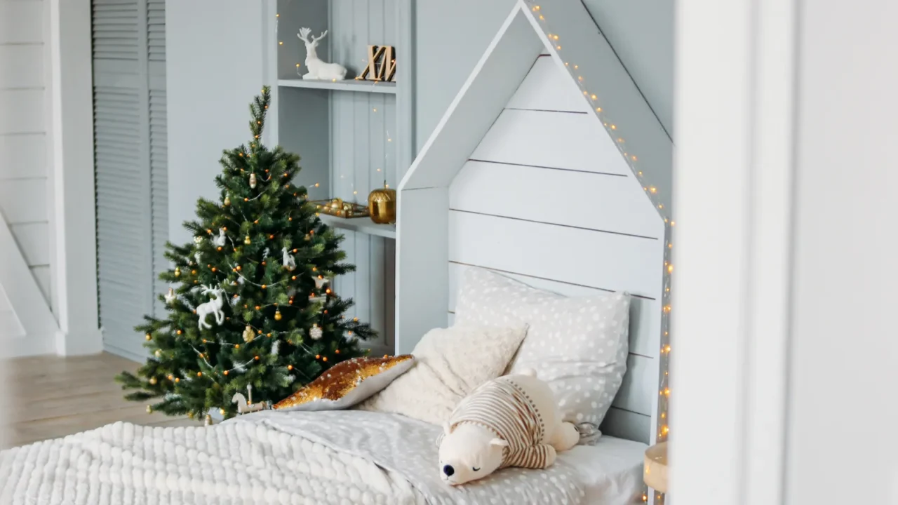 the wooden children bed with pillows and toys minimalistic christmas