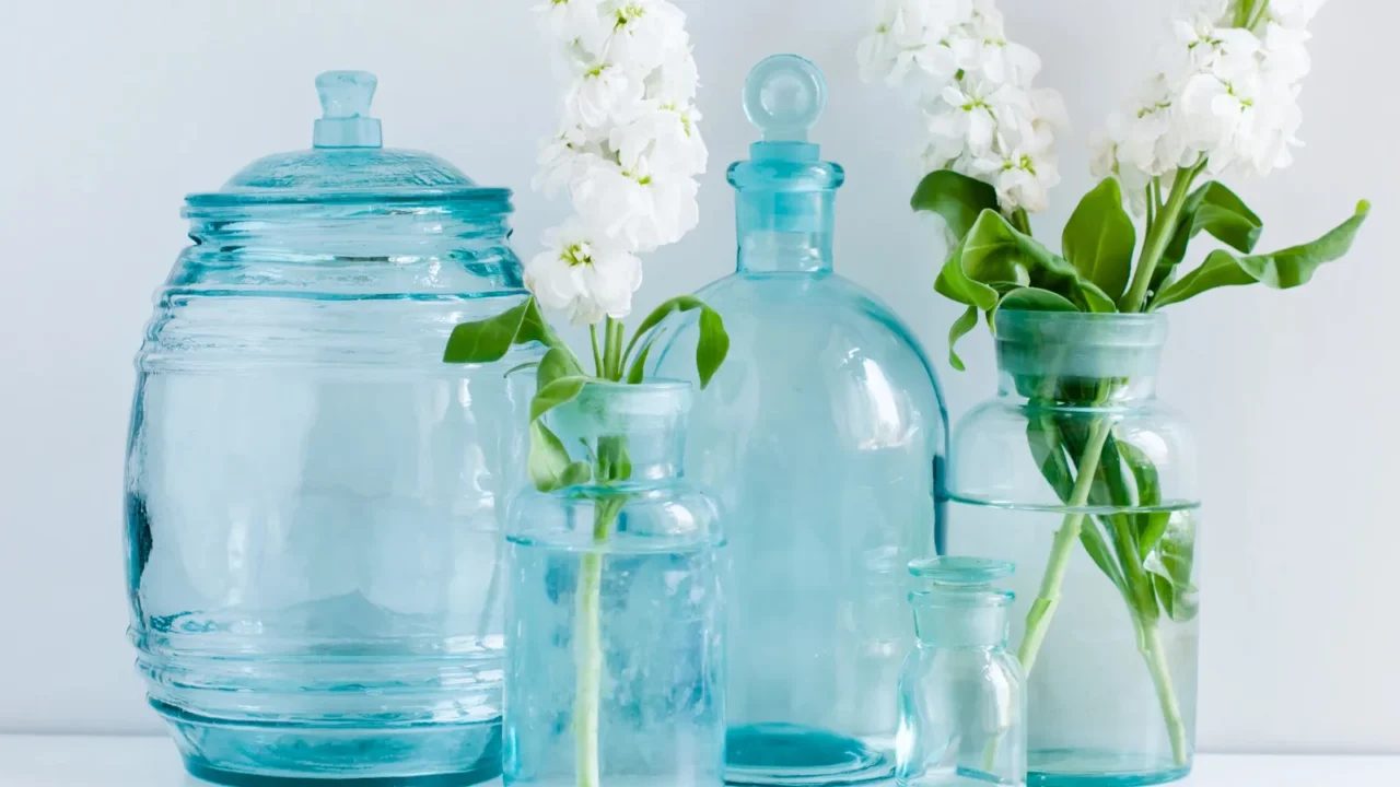 Vintage home decor. Blue glass vases with white flowers.