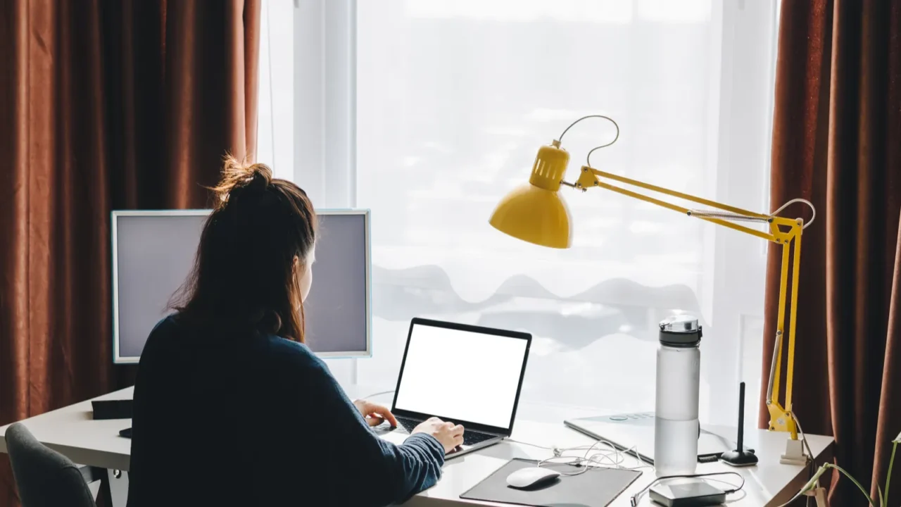 woman working on laptop at home telework freelance concept