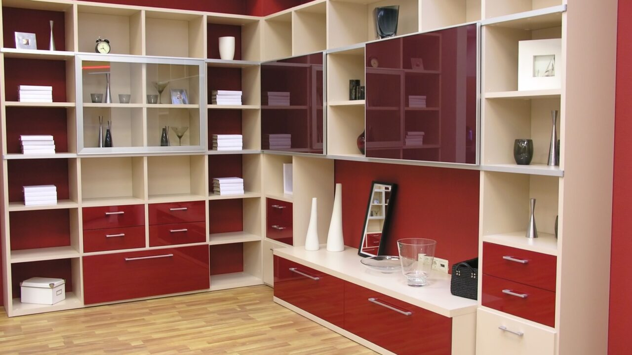 Tall red glossy shelves in a Livingroom.