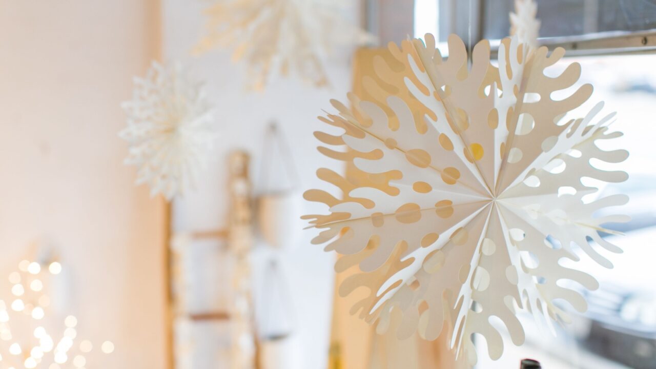 Paper snowflake hanging from ceiling close up