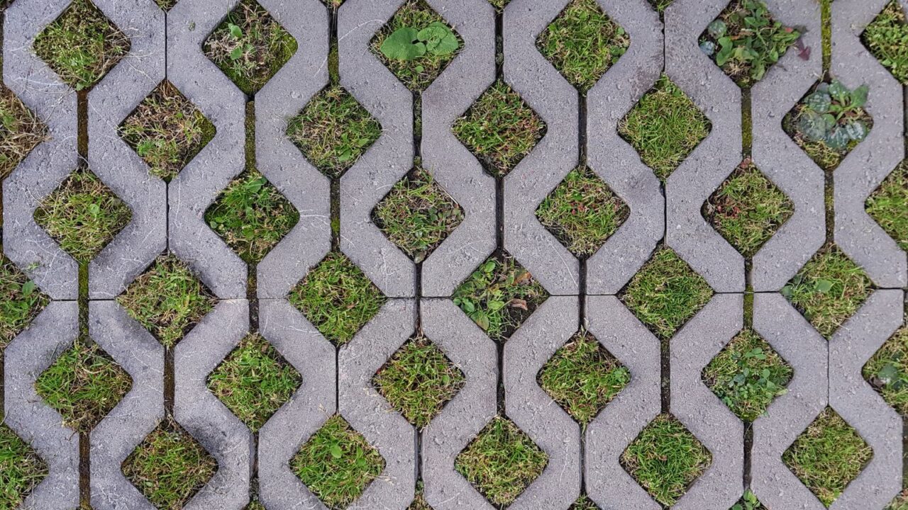 Concrete permeable pavers with grass.