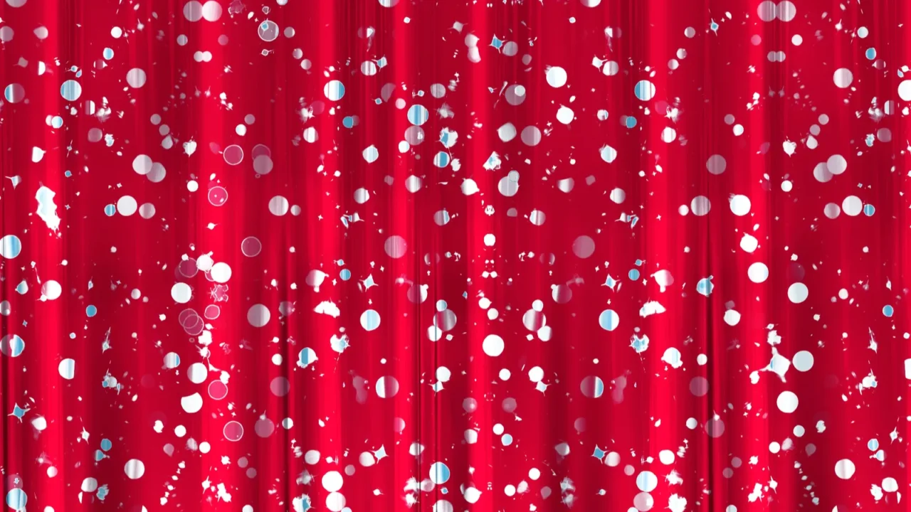 a closeup of a silky red curtain with a pattern