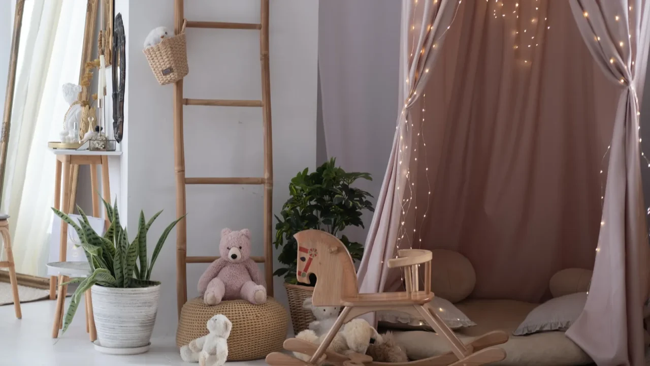 a welcoming playroom features a cozy nook draped in soft