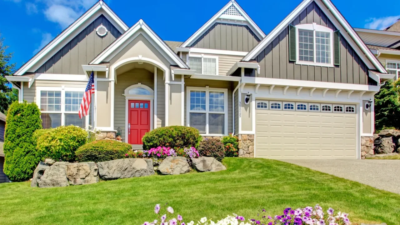 american house with beautiful landscape and vivid flowers