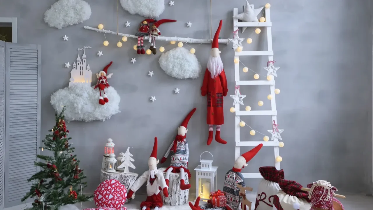 Beautiful Christmas decor for children. Clouds, santa, and a decorated ladder with lights, ornaments and a star at the top. Lanterns and Christmas tree also placed on the floor.