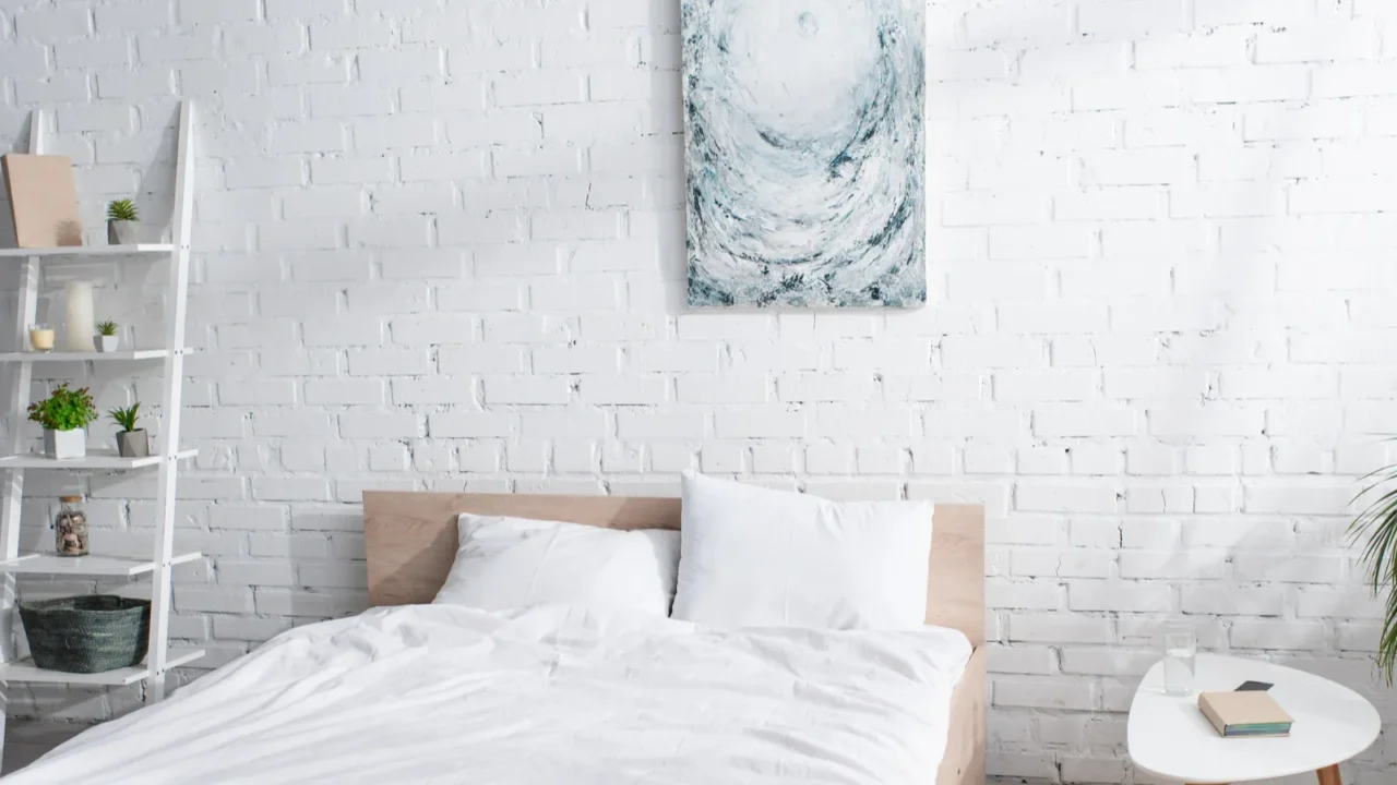 bed with white bedding in modern bedroom