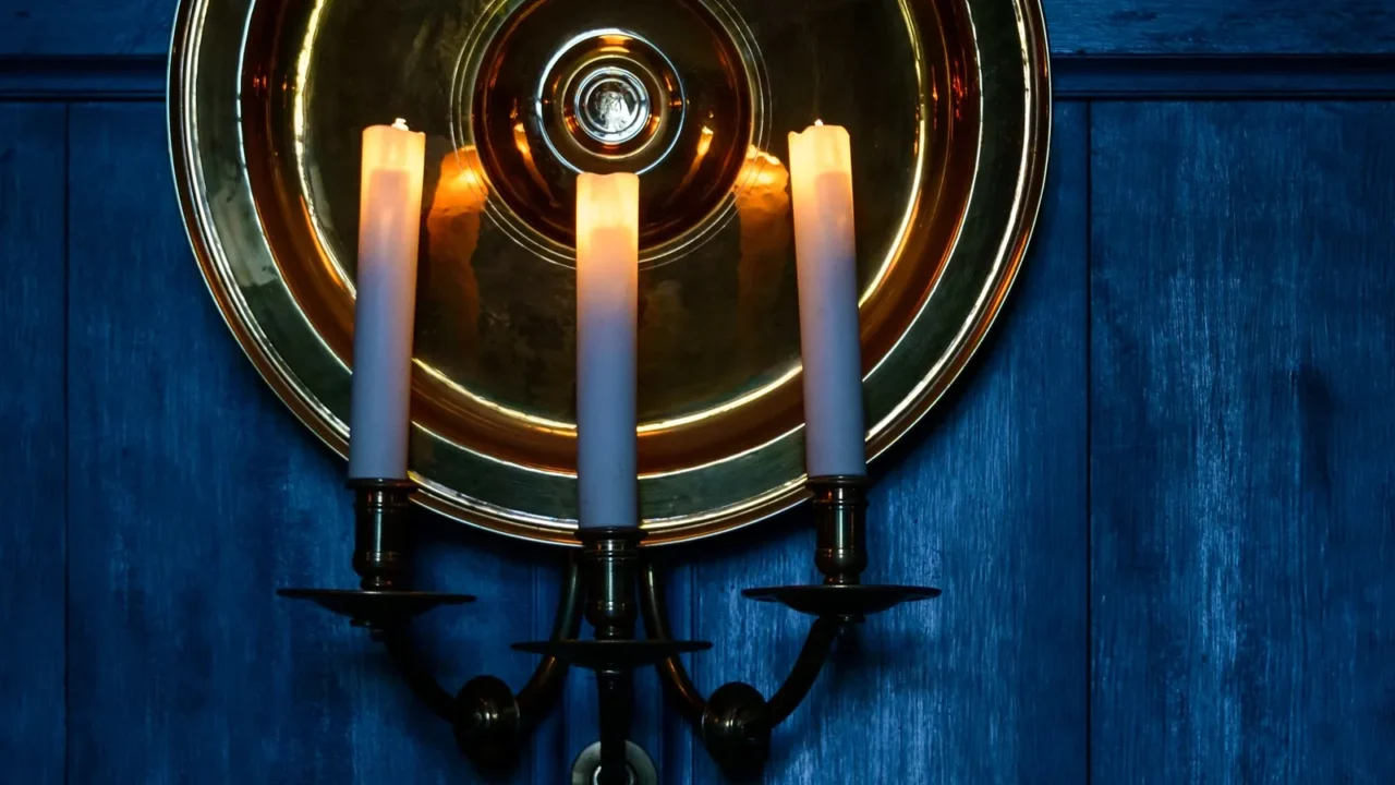 candles and blue wooden background