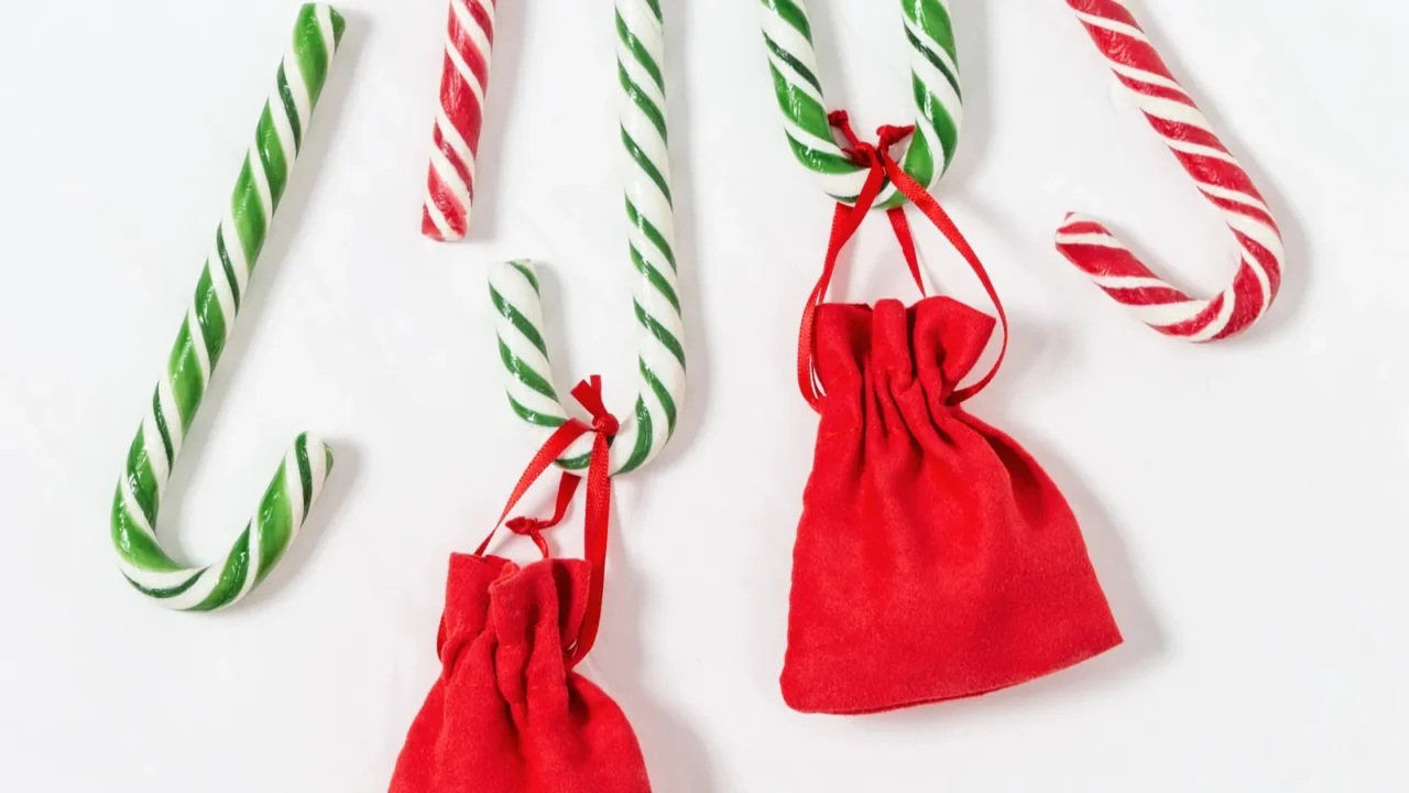 christmas background with striped candy canes and gifts in small