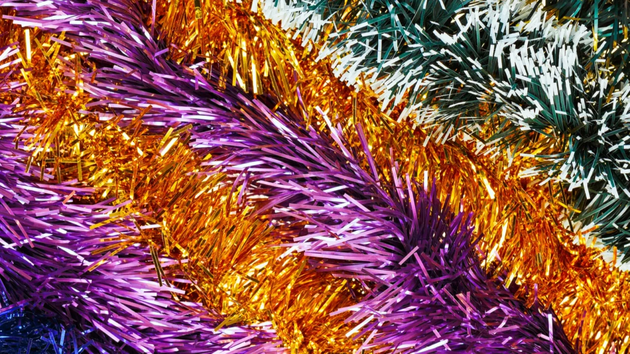 christmas tinsel multicolored decoration laid diagonally