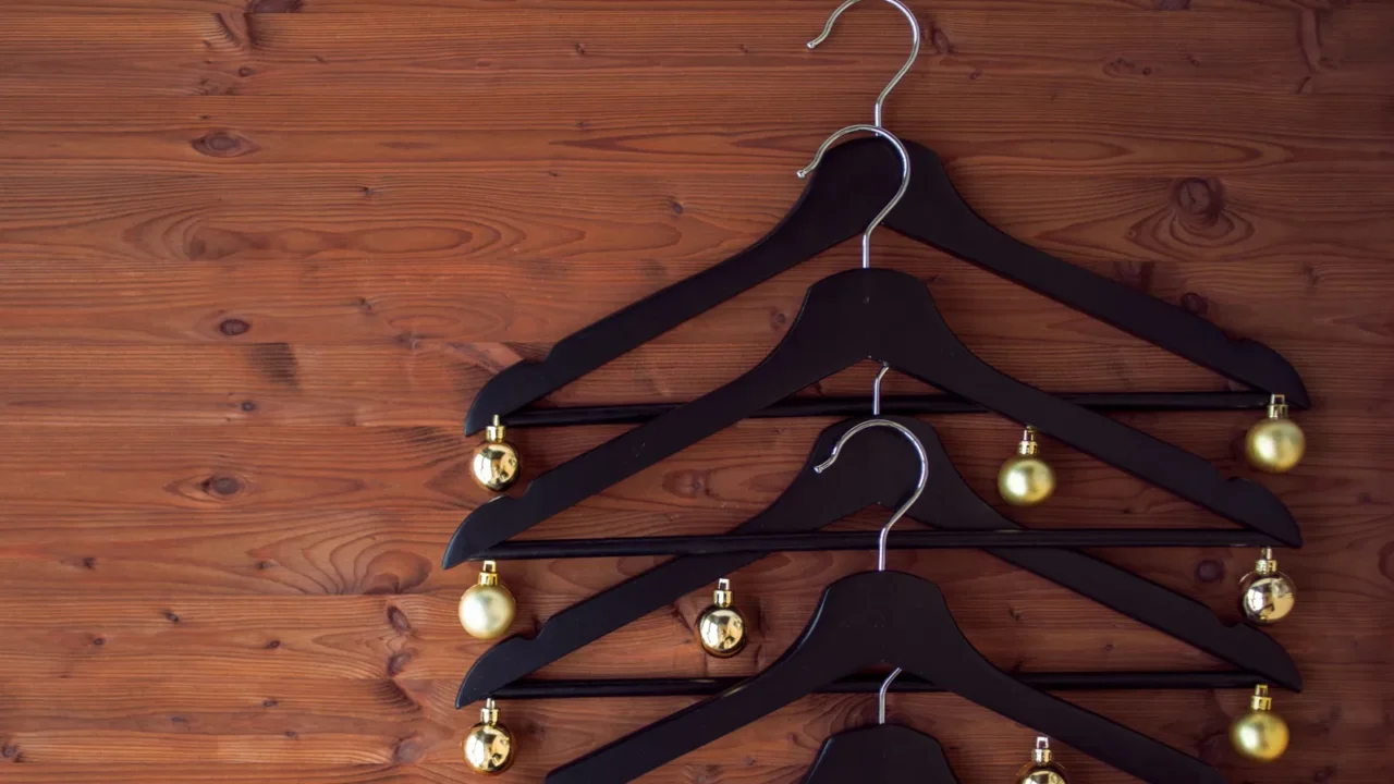 christmas tree from hangers decorated with a gold balls a