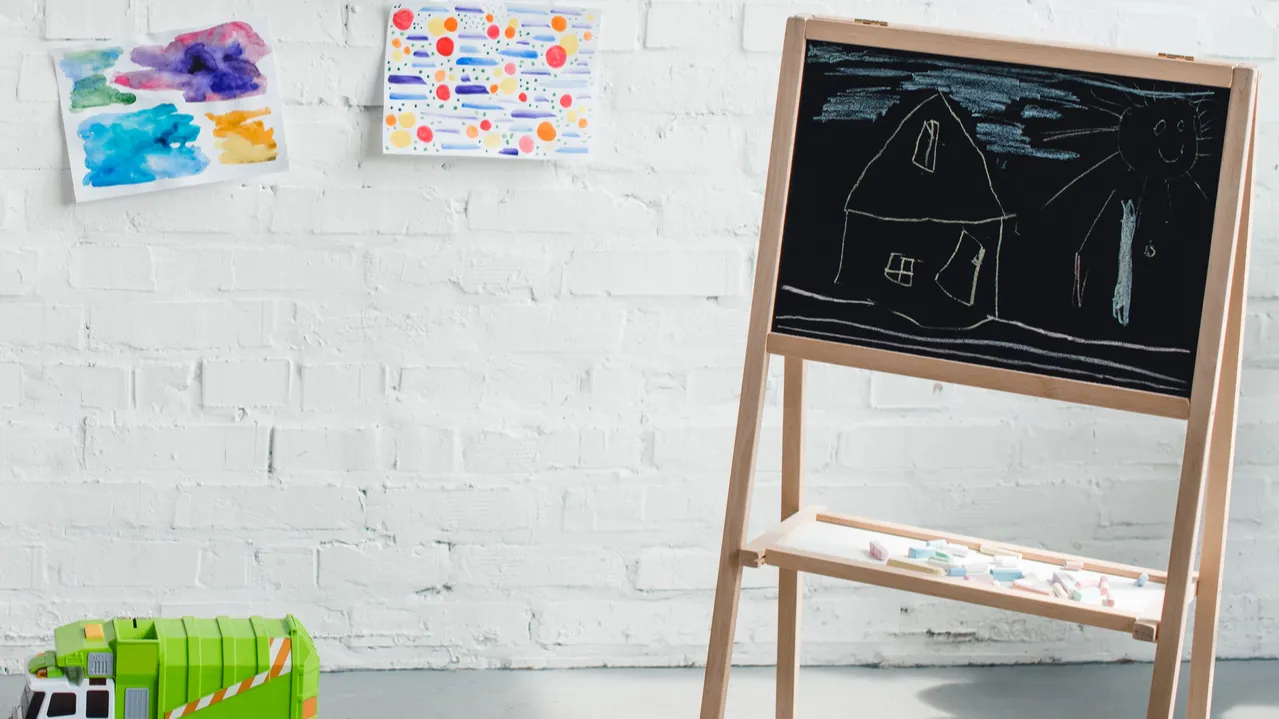 close up view of empty childish room with sofa blackboard