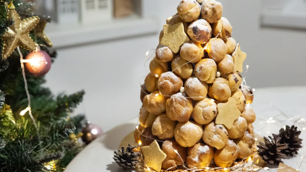 croquembouche profiteroles cake with caramel and vanilla custard cream for