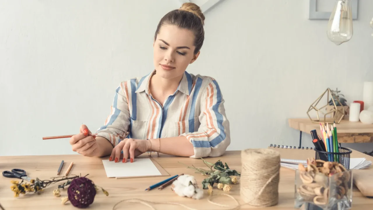 A woman sitting at the desk.