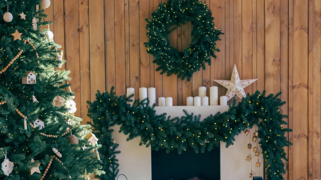 festive christmas tree in living room interior with fireplace decorated