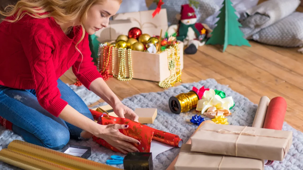 girl wrapping gift boxes