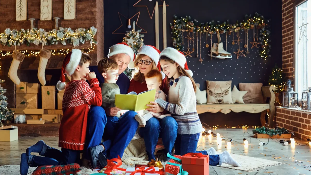 grandparents reading a book with a child in the room