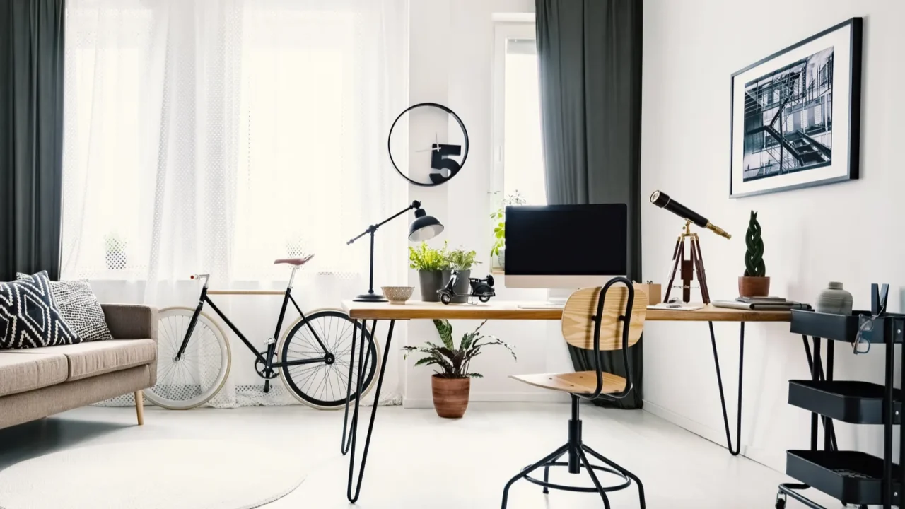 hairpin table with retro telescope computer plants and lamp standing