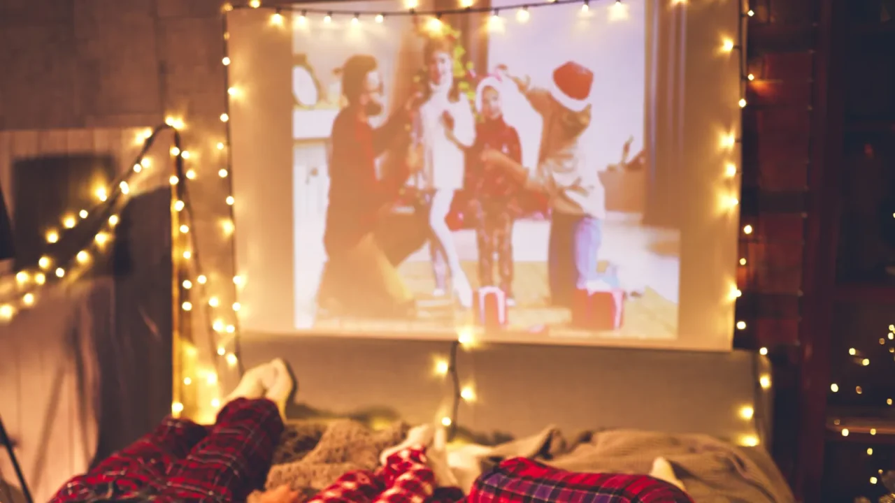 happy family in checkered pajamas mother father and children watching