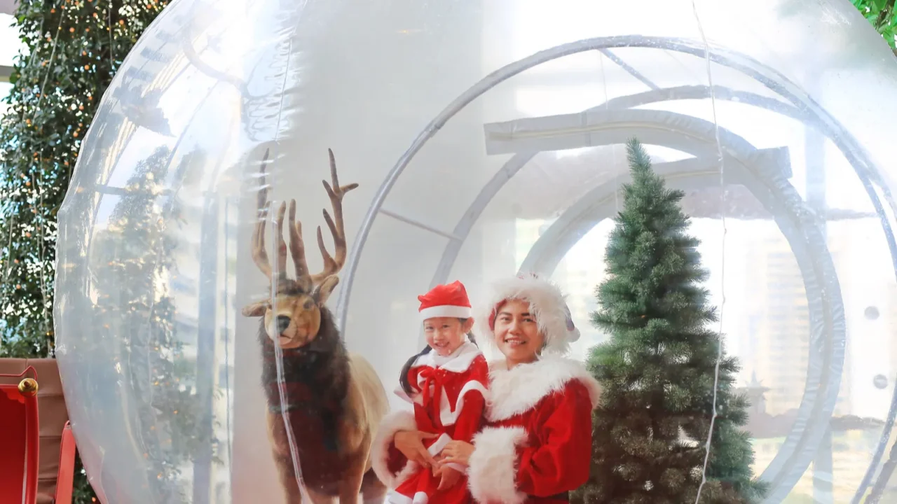 happy little child girl and mother in santa costume dress