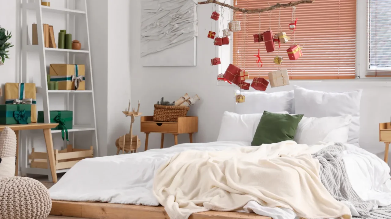 interior of festive bedroom with christmas decorations and hanging gift