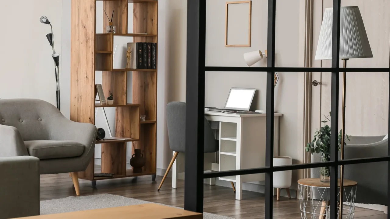 interior of light living room with armchair bookcase and modern