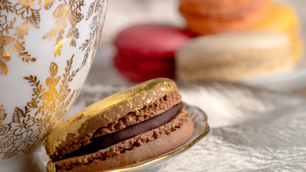 luxurious scene featuring a goldtrimmed teacup paired with a chocolate