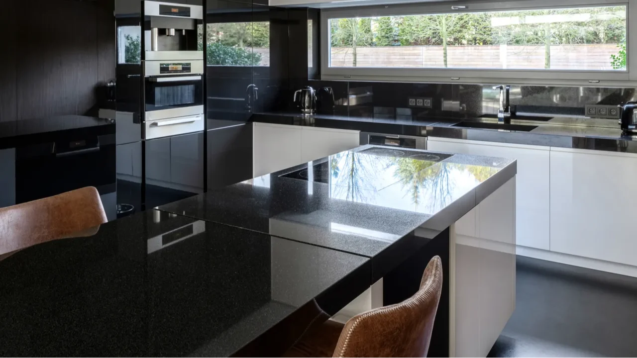 modern black and white kitchen with kitchen island and dining