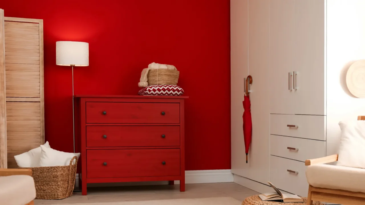 modern room interior with red chest of drawers